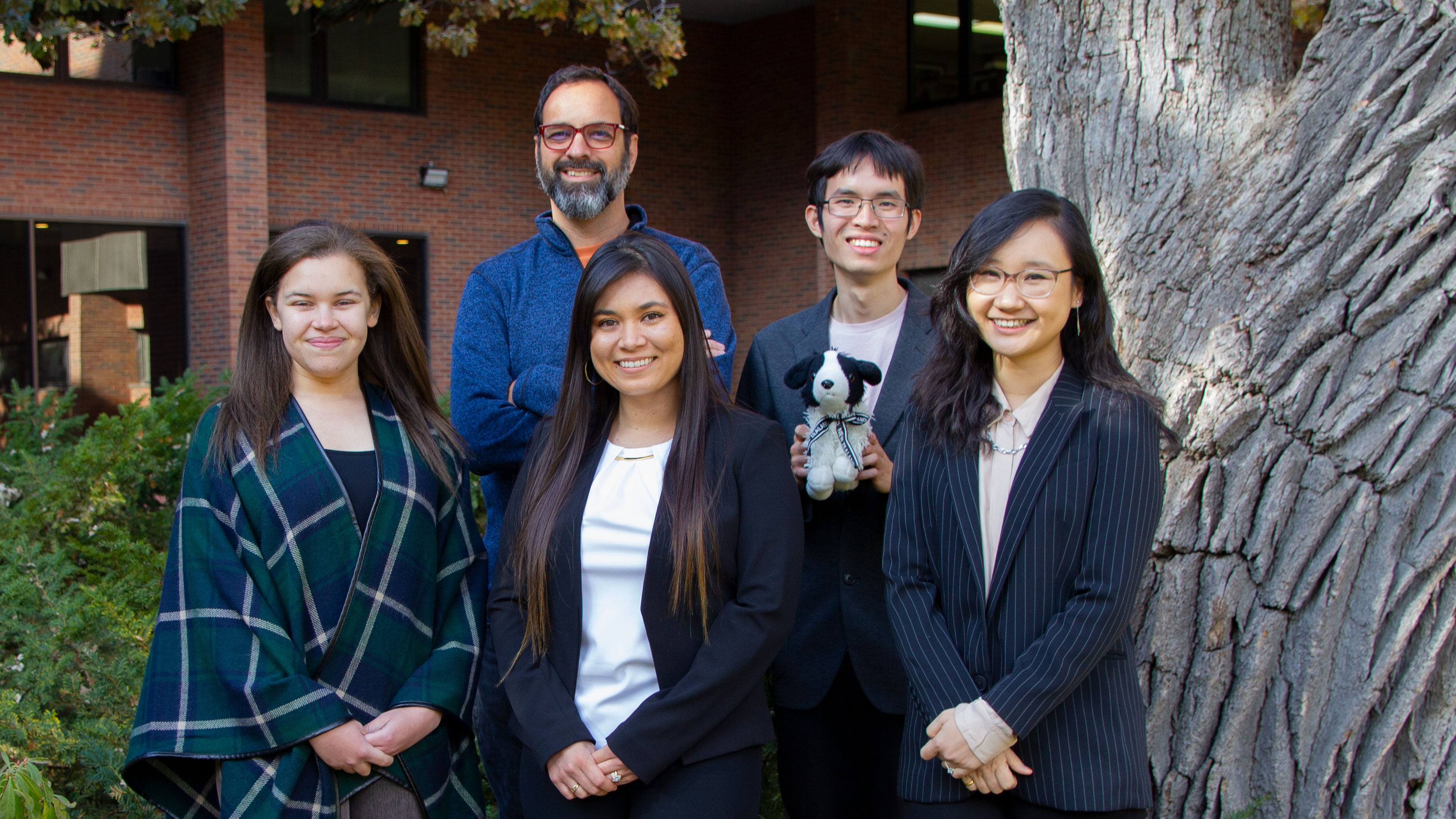 members of the nice research group, standing in front of a tree